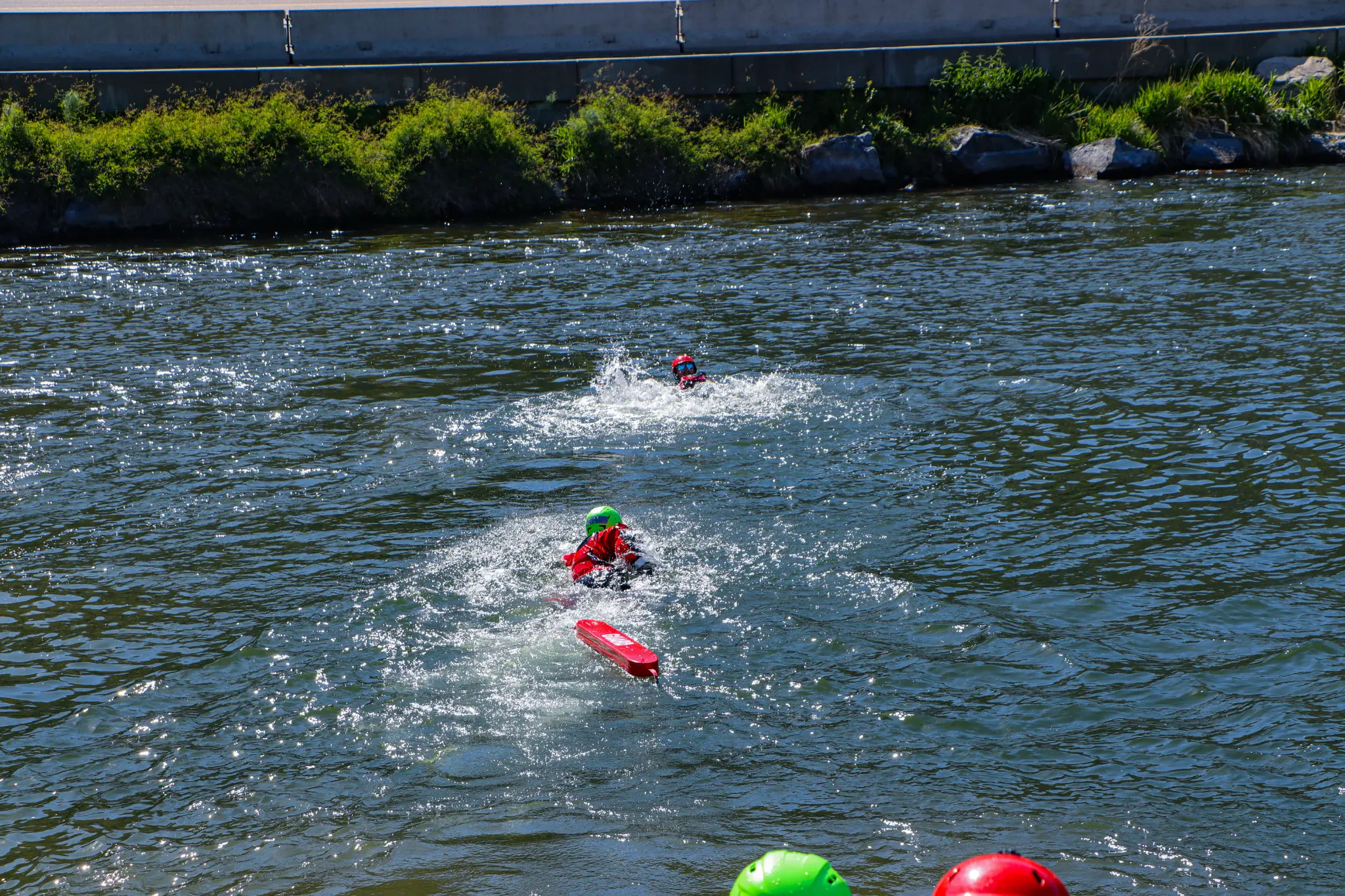 Surface water rescue - swimmers practicing in-water techniques