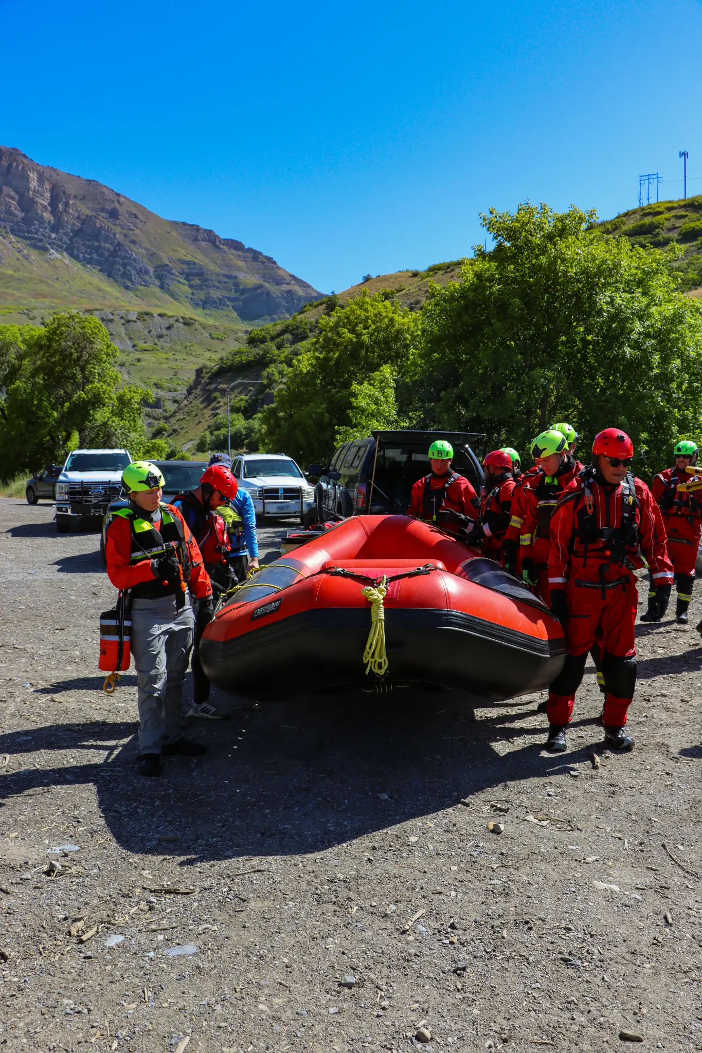 Surface water rescue - team preparing inflatable boat at staging area
